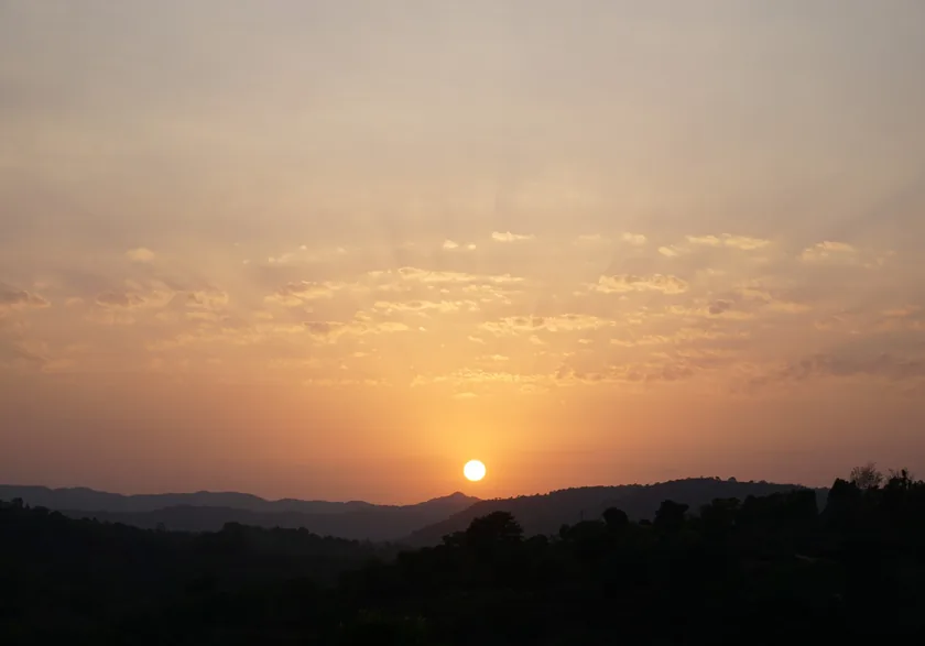 The sun going down behind the hills near Rajgad Fort, seen from the farmstay.