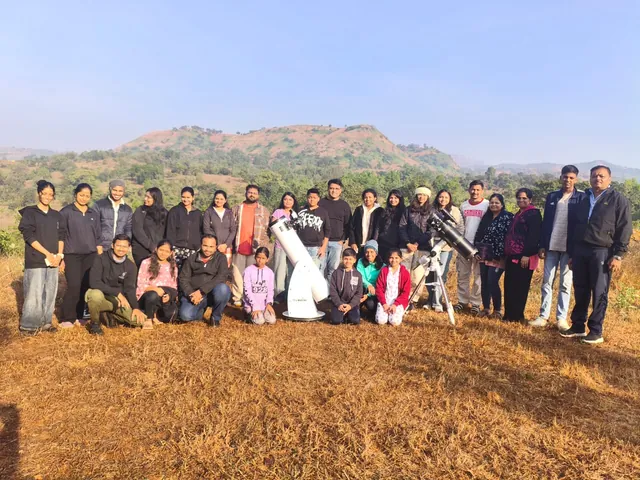 Guests from a past stargazing night with a large telescope on the farm.