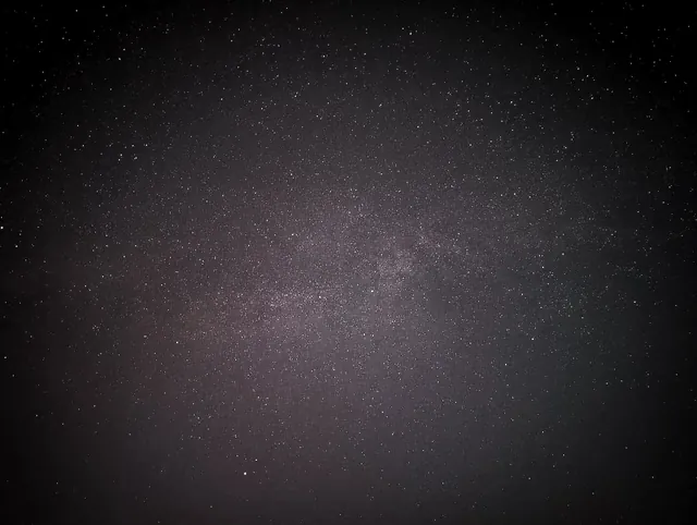 A sky full of stars over the farm, far from city lights.